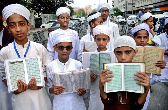 Activists of Majlis Khatm-e-Nabuwwat Pakistan take part in a protest demonstration at Karachi Press Club against the dishonor of holy Quran outside a Stockholm Mosque