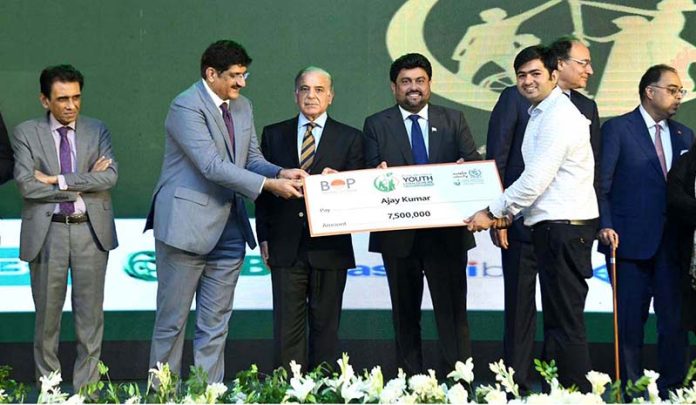 Prime Minister Muhammad Shehbaz Sharif distributing cheques among the successful candidates under PM's Youth Business Loan Scheme at Governor House