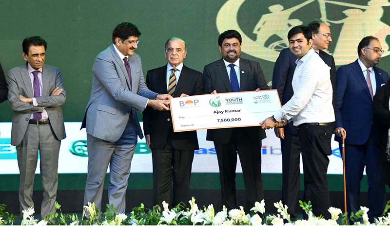 Prime Minister Muhammad Shehbaz Sharif distributing cheques among the successful candidates under PM's Youth Business Loan Scheme at Governor House