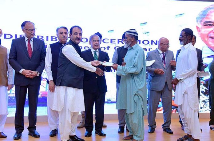 Prime Minister Muhammad Shehbaz Sharif distributes cheques among the fishermen of Gwadar