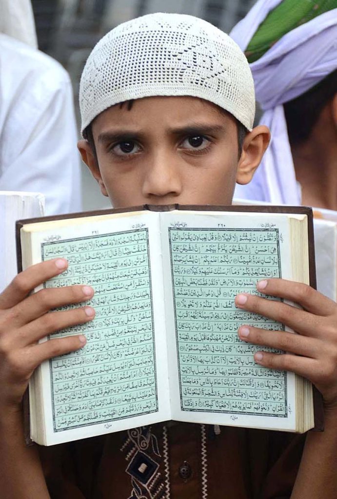 Activists of Majlis Khatm-e-Nabuwwat Pakistan take part in a protest demonstration at Karachi Press Club against the dishonor of holy Quran outside a Stockholm Mosque