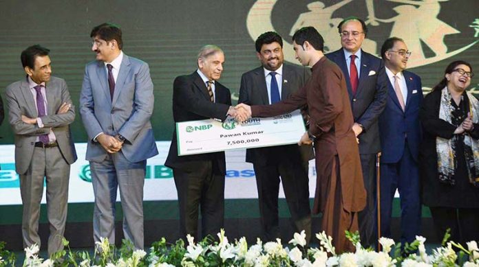 Prime Minister Muhammad Shehbaz Sharif distributing cheques among the successful candidates under PM's Youth Business Loan Scheme at Governor House