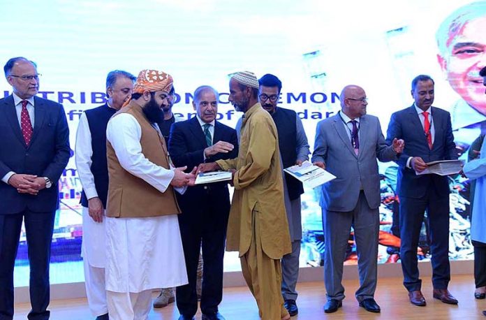 Prime Minister Muhammad Shehbaz Sharif distributes cheques among the fishermen of Gwadar