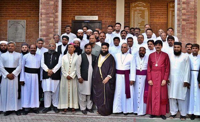 Hafiz Tahir Mahmood Ashrafi, Chairman Pakistan Ulema Council and Special Representative to PM on Interfaith Harmony in a group photo with other religious leaders after addressing a joint press conference and strongly condemns despicable act of desecration of Holy Quran in Sweden at Central Cathedral of Praying Hands Church