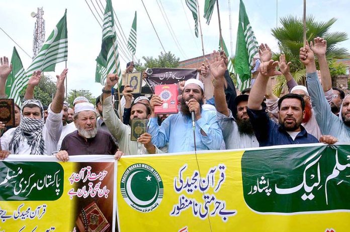 Pakistan Markazi Muslim League workers protesting against desecration of Holy Quran outside a Stockholm Mosque in front of Press Club