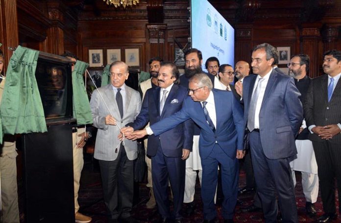Prime Minister Muhammad Shehbaz Sharif unveiling the plaque of the groundbreaking of Ombre Special Economic Zone Lahore