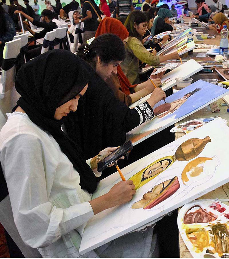 Visitors taking selfie with handicrafts at Dastkaar Mela organized by Punjab Small Industries in cooperation with Government of the Punjab “Pakistan Handicraft Shops Promoting Artisans and Handicrafts