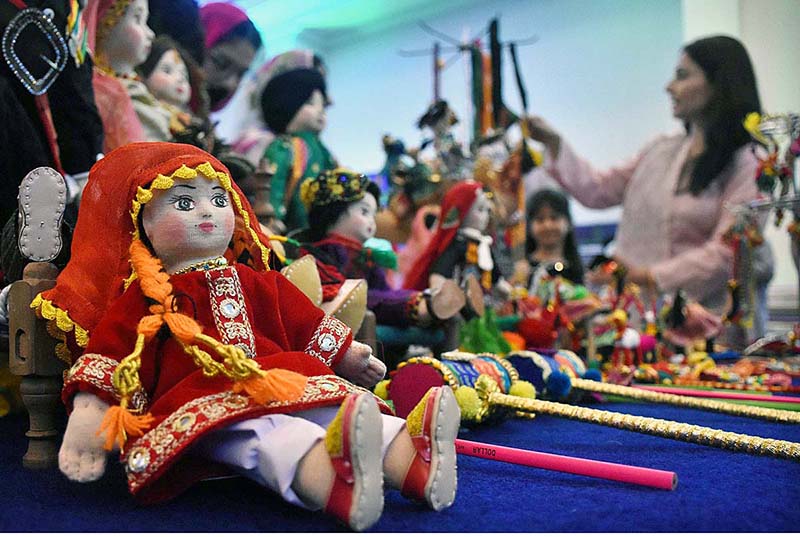 Visitors taking selfie with handicrafts at Dastkaar Mela organized by Punjab Small Industries in cooperation with Government of the Punjab “Pakistan Handicraft Shops Promoting Artisans and Handicrafts