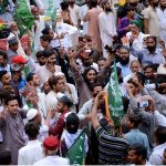 Activists take part in a protest demonstration at Karachi Press Club against the burning of holy Quran outside a Stockholm Mosque