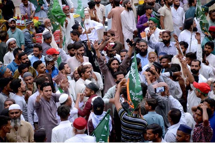 Activists take part in a protest demonstration at Karachi Press Club against the burning of holy Quran outside a Stockholm Mosque