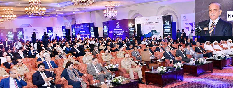 Prime Minister Muhammad Shehbaz Sharif addresses the National IT seminar. Chief of Army Staff General Syed Asim Munir attended the seminar as guest of honor