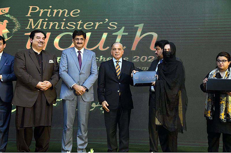 Prime Minister Muhammad Shehbaz Sharif distributes laptops among the high achievers of public sector universities of Sindh under PM's Youth Laptop Scheme 2023 at Governor House