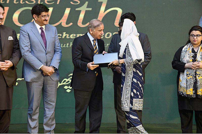 Prime Minister Muhammad Shehbaz Sharif distributes laptops among the high achievers of public sector universities of Sindh under PM's Youth Laptop Scheme 2023 at Governor House