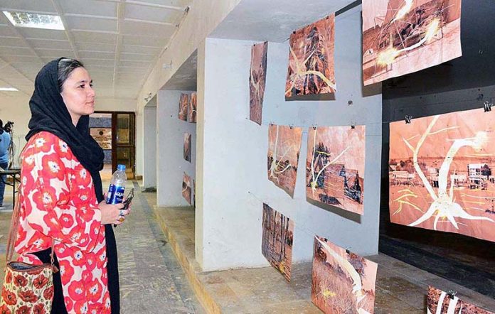 Participants viewing photo Art exhibition titled “The Forgotten Flood” organized by Loc Sujag at Sindh Museum