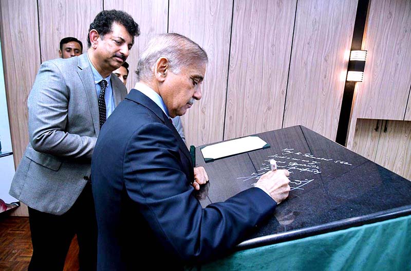 Prime Minister Muhammad Shehbaz Sharif signs a commemorative board during the groundbreaking ceremony of Islamabad Model Special Economic Zone