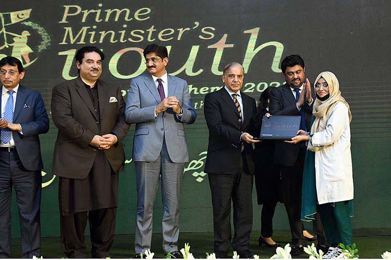 Prime Minister Muhammad Shehbaz Sharif distributes laptops among the high achievers of public sector universities of Sindh under PM's Youth Laptop Scheme 2023 at Governor House