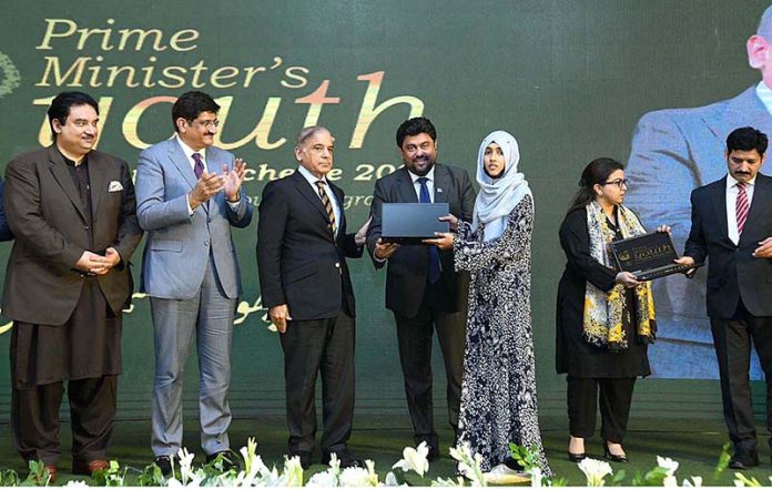 Prime Minister Muhammad Shehbaz Sharif distributes laptops among the high achievers of public sector universities of Sindh under PM's Youth Laptop Scheme 2023 at Governor House