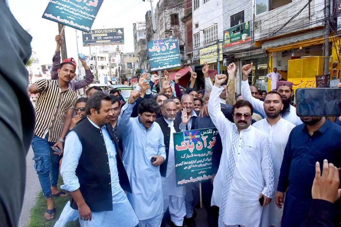 The condemnation rally against the desecration of the Holy Quran in Sweden attended by PML-N Senior Vice President Punjab Mohammad Manshaullah Butt with other party members at Chowk Allama Iqbal