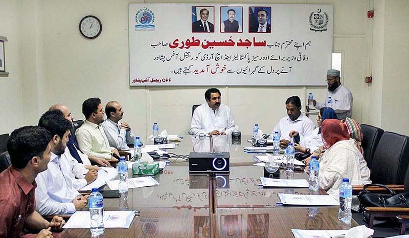 Federal Minister for Overseas Pakistanis & HRD, Sajid Hussain Turi chairing a meeting at OPF Regional Office