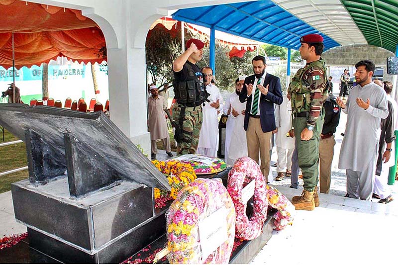 Special Assistant to the Prime Minister on Interior, Ataullah Tarar lays a floral wreath at the mausoleum of Captain Shaheed Colonel Sher Khan (Nishan-e-Haider) and offers Fateha on the occasion of his 24th Martyrdom Anniversary