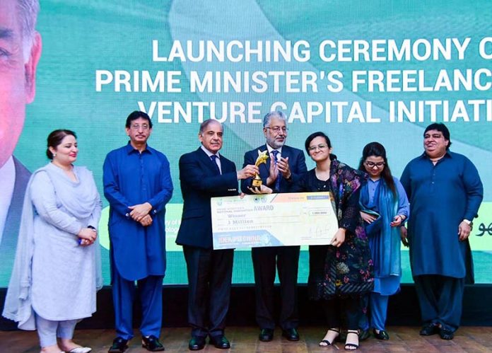 Prime Minister Muhammad Shehbaz Sharif presenting cash prize of Rs.1 million each to recipients of 'National Innovation Awards' during Launching Ceremony of PM's Freelancers & Venture Capital Initiative