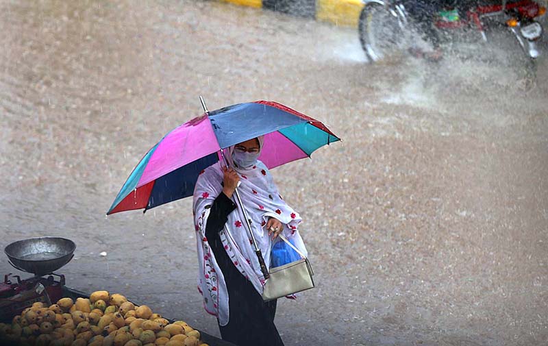 Children enjoying play in rain water on the road at Ghouri Town