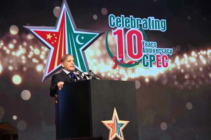 Prime Minister Muhammad Shehbaz Sharif addressing a ceremony to commemorate the 10th anniversary of the commencement of China Pakistan Economic Corridor
