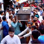 Relatives of deceased shifting bodies of tourist four people (Three female and one male) from the same house who died in a passenger coach that fell into a ditch in Gilgit are being brought to their residence in Sarfraz Colony
