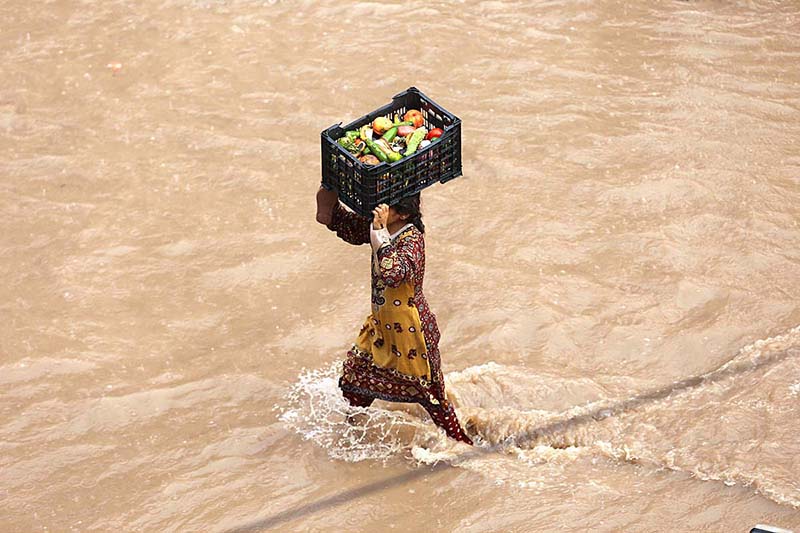 Children enjoying play in rain water on the road at Ghouri Town