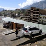 A local person washing the vehicle near Swat river