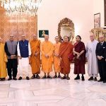 President Dr. Arif Alvi in a group photo with a delegation of venerated monks, who are attending the International Gandhara Symposium 2023