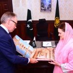 Federal Minister for Information and Broadcasting, Marriyum Aurangzeb presenting a coffee table book to Ambassador of Australia, Neil Hawkins