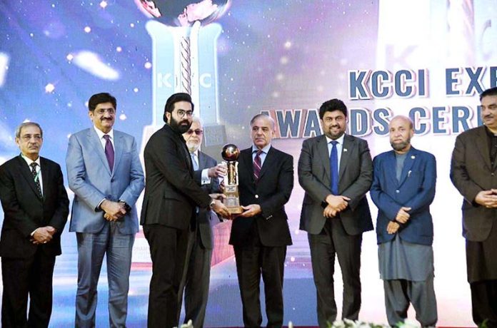 Prime Minister Muhammad Shehbaz Sharif presenting awards to highest exporters at 