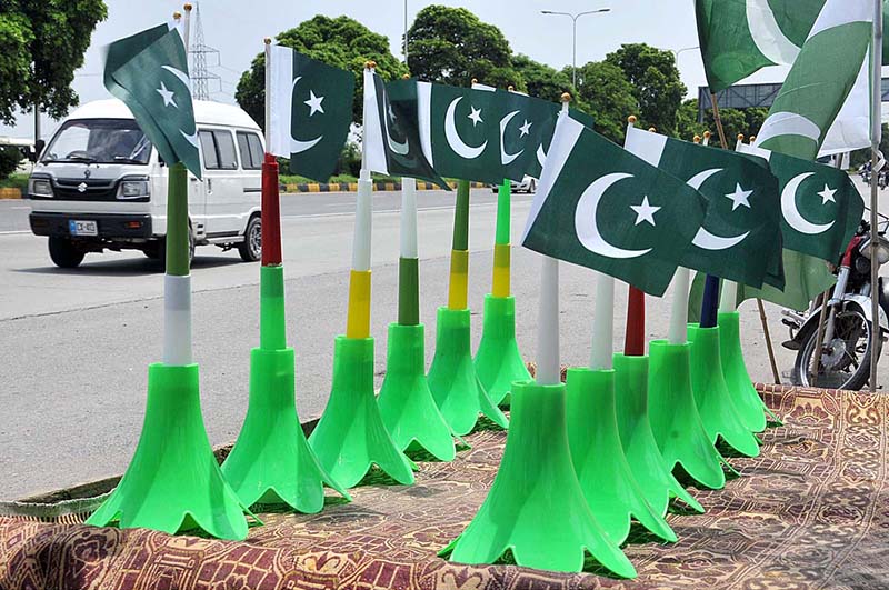 Vendors displaying national flag and other stuff at roadside in connection with upcoming Independence Day celebrations