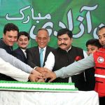Chairman Pakistan Red Crescent Society Sardar Shahid Ahmed Laghari along with other PRCS members cutting cake on the occasion of 77th Independence Day celebration