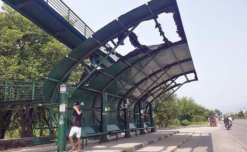 A view of damaged bus stop shed at Islamabad Expressway needs the attention of concerned authorities