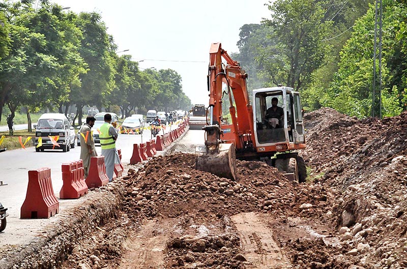 Heavy machinery being used for expansion work of Club Road during development work in Federal Capital