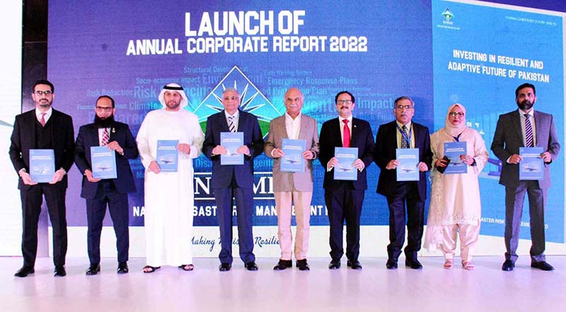 Caretaker Federal Minister for Planning and Development Muhammad Sami Saeed in a group photo during the launch of Annual Corporate Report 2022 of NDRMF project "Optimizing Impact-Investing in Resilient and Adaptive Future of Pakistan