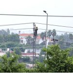 A WAPDA worker fixing the faulty cables on an electric pylon at Faizabad neighbourhood