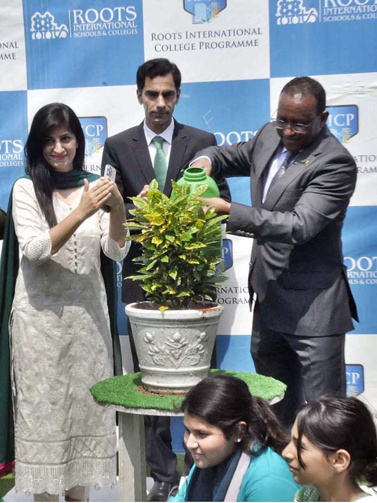 Ambassador of Ethiopia H.E. Jemal Beker Abdula along with Principal, Ms. Sobia Abid in a group photograph with students in connection with 77th Independence Day celebration at Roots International Schools & Colleges, H-8