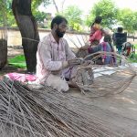 Gypsy Family busy making Baskets from dry tree branches at roadside setup