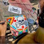 A painter busy in paint the part of truck at his workplace at Pirwadahi