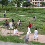 A group of youngsters playing volleyball at roadside greenbelt in Federal Capital