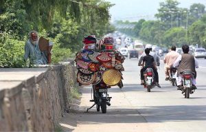 A vendor selling handmade stuff to attract customers at Expressway in the Federal Capital