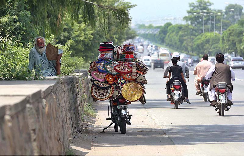 A vendor selling handmade stuff to attract customers at Expressway in the Federal Capital