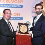 Caretaker Federal Minister for Water Resources, Ahmad Irfan Aslam giving shield to the participant during the launching ceremony of National Master plan on flood telemetry