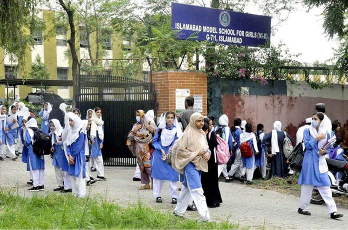 Students attending school after the summer vacation on the opening day after two month at G-7 sector