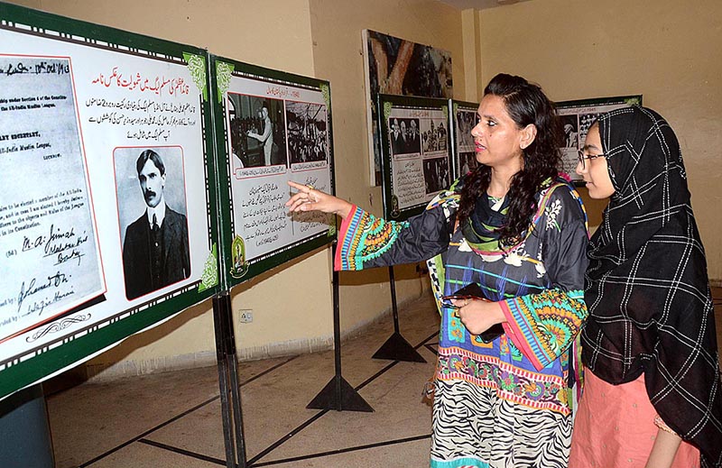 Visitor women watching the Photographic Exhibition of Quaid e Azam in connection to the upcoming independence day at the Arts Council
