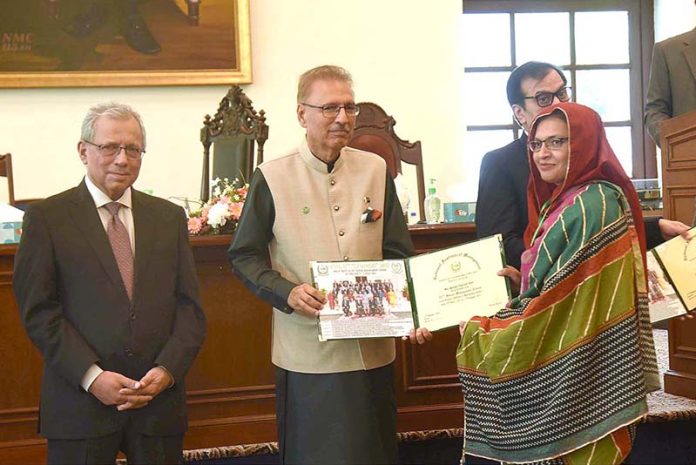 President Dr. Arif Alvi distributes certificates among the participants of Graduation Ceremony of NMC at National School of Public Policy
