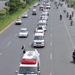 PRCS ambulances are participating in a flag march on the occasion of 77th Independence Day celebration